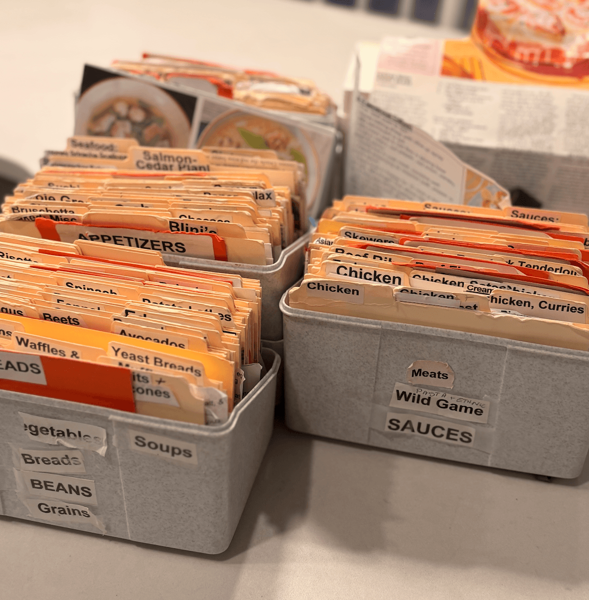 Boxes of physical recipe cards — the kind of collection MyJamm helps you digitize